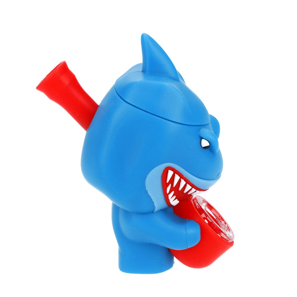 A side view of the Shark Silipipe, showing the blue, cartoon-like pipe with a red mouthpiece and sculpted details.
